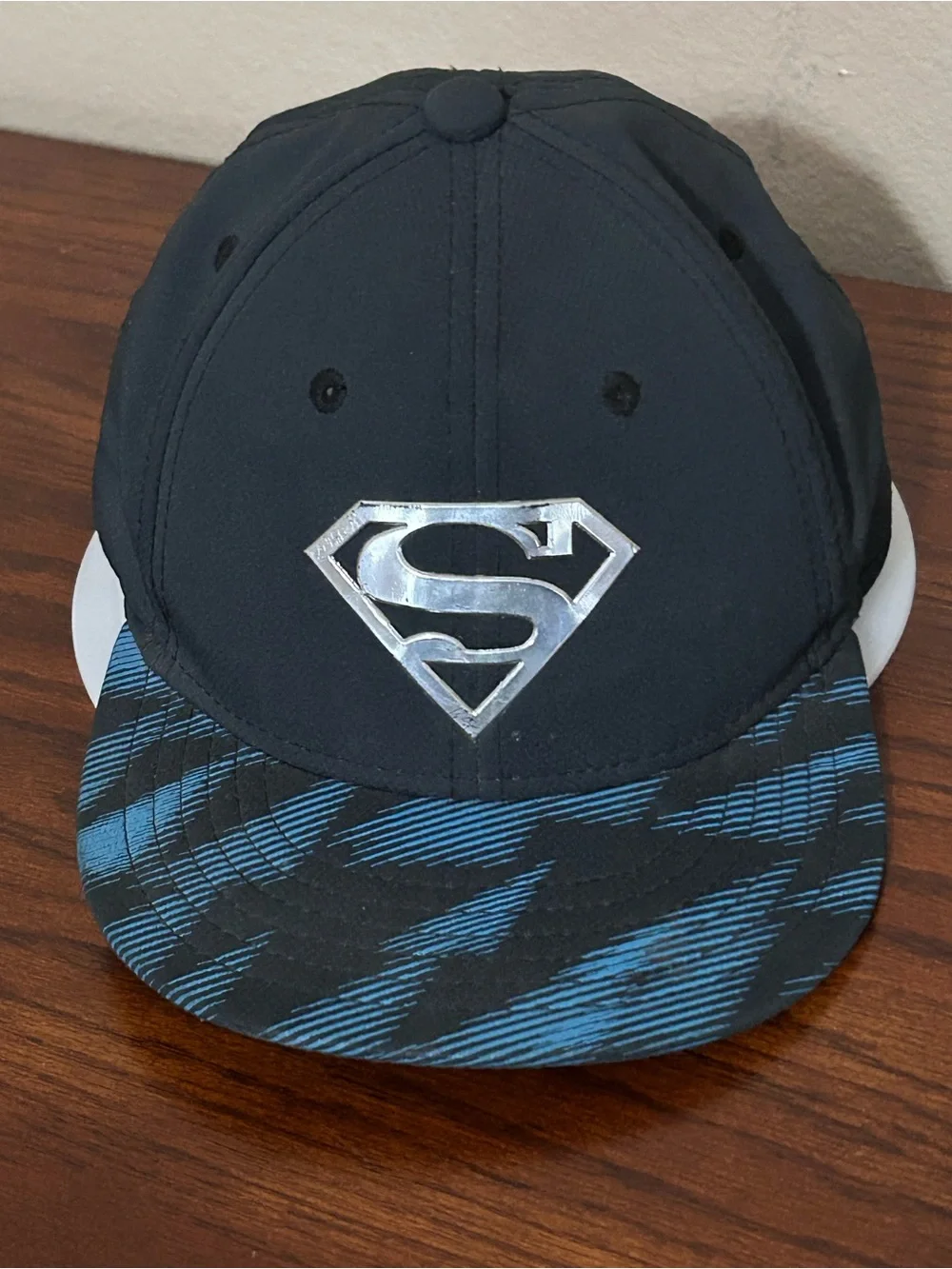 Under Armour Superman Kids Black Snapback Hat with Blue Patterned Brim
